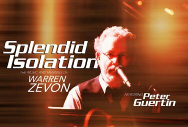 Promotional poster for Splendid Isolation featuring Warren Zevon performing with a microphone and guitar under warm stage lighting.
